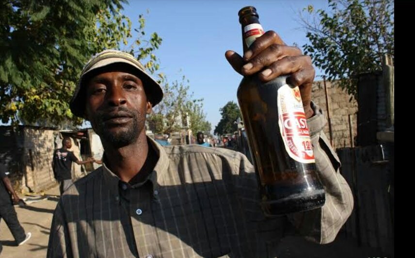 man holding beer