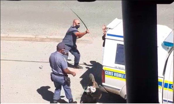 Police officers caught heavily beating up 2 men