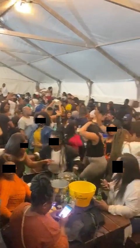 Video shows people inside overcrowded tavern ignoring Covid-19 rules, no masks & social distancing