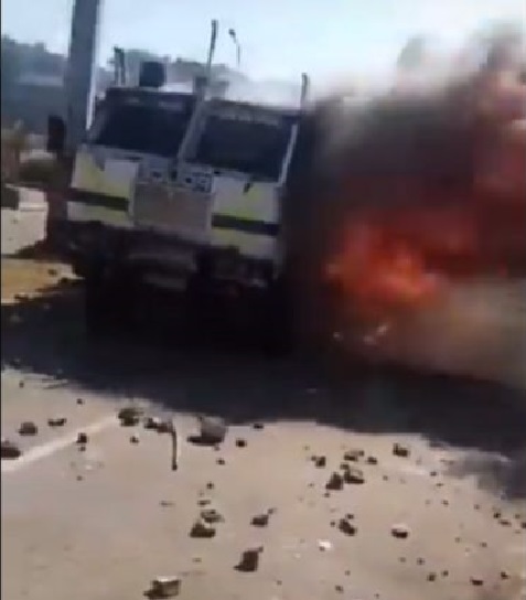 Police officers flee on foot as protesting WSU students set their vehicle on fire