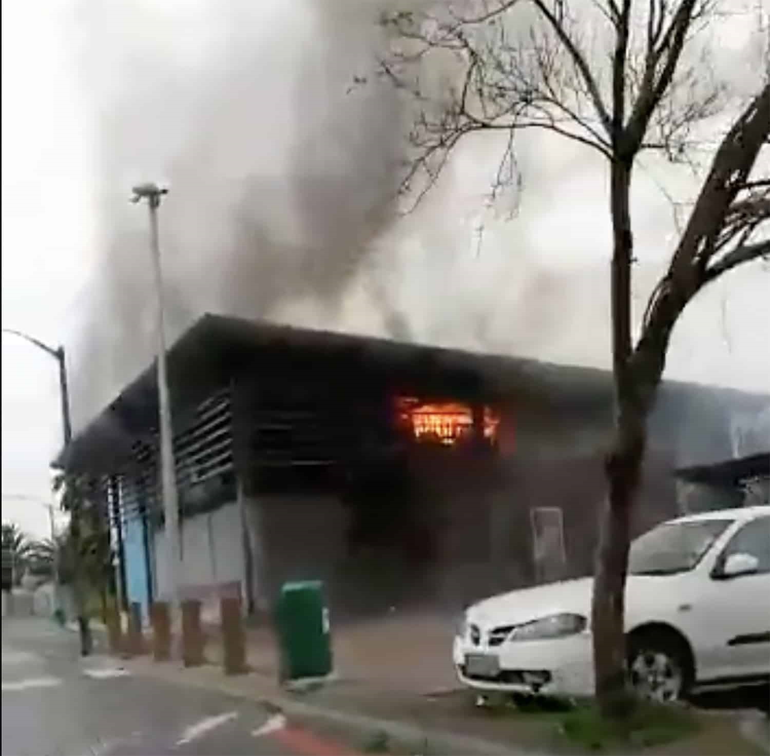 building on fire taxi violence cape town