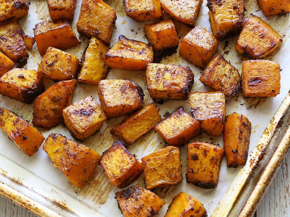 An easy recipe for savoury baked pumpkin, seasoned with olive oil, garlic, and chilli powder. It's such a wonderful side dish. Oven-roasting is one of my favourite ways to make this tasty winter squash! When you think about pumpkin, do you only think about pumpkin pie? If so, you're missing out! Pumpkin can take on either sweet or savoury flavours, and it makes a wonderful, hearty, and satisfying savoury side dish, perfect for fall and winter. I actually think I like savoury pumpkin dishes better than I like sweet ones. I love chocolate and cheesecake desserts much more than pumpkin desserts. But savoury pumpkin dishes are amazing. INGREDIENTS You'll only need FIVE simple ingredients to roast a pumpkin! The exact measurements are included in the recipe card below. Here's an overview of what you'll need: Sugar pumpkin: Small pumpkins are more flavorful. They do vary in size, from 2 lb. to 5 lb., but whatever their size, as long as they are marked as "sugar pumpkin" or "sugar pie pumpkin," that's what you need. Olive oil: I love cooking with this delicious oil. Melted butter is another tasty option. Seasonings: I use kosher salt, chilli powder, and garlic powder. In this particular recipe, I prefer garlic powder to minced fresh garlic, because it more evenly coats the pumpkin. INSTRUCTIONS So how do you roast pumpkin? In this easy recipe, the pumpkin is seasoned with olive oil, garlic, and chilli powder. Then it's baked in a hot oven until tender. This flavour combination is phenomenal! Please scroll down to the recipe card for detailed instructions. Here are the basic steps: Your first step is to slightly soften the pumpkin in the microwave, then carefully cut it in half and remove the pulp and seeds. Next, you cut each pumpkin half into four 1-inch-thick moon-shaped slices. Use a vegetable peeler to peel the skin off. Cut the peeled pumpkin slices into cubes. Place the pumpkin cubes in a large bowl and coat them with olive oil and spices. Transfer the seasoned pumpkin pieces to a parchment-paper-lined rimmed baking sheet. Roast them until fork-tender, about 30 minutes at 425°F, tossing them halfway through. AN ALTERNATIVE METHOD Another option, shown in the video below, is to skip the peeling, slicing and cubing. Simply cut the pumpkin in half, remove the pulp and seeds, and place it cut-side-down on a parchment-lined rimmed baking sheet. As before, cook the pumpkin until fork-tender, about 30 minutes at 425°F. The result is not so much a side dish as a cooked pumpkin that you can then use in other recipes. SERVING SUGGESTIONS Anything goes with this side dish. It's as versatile as potatoes. Since I cook the pumpkin in a 425°F oven, I do like to serve it with the main dish that I can cook in the same oven. source - cooking365coza