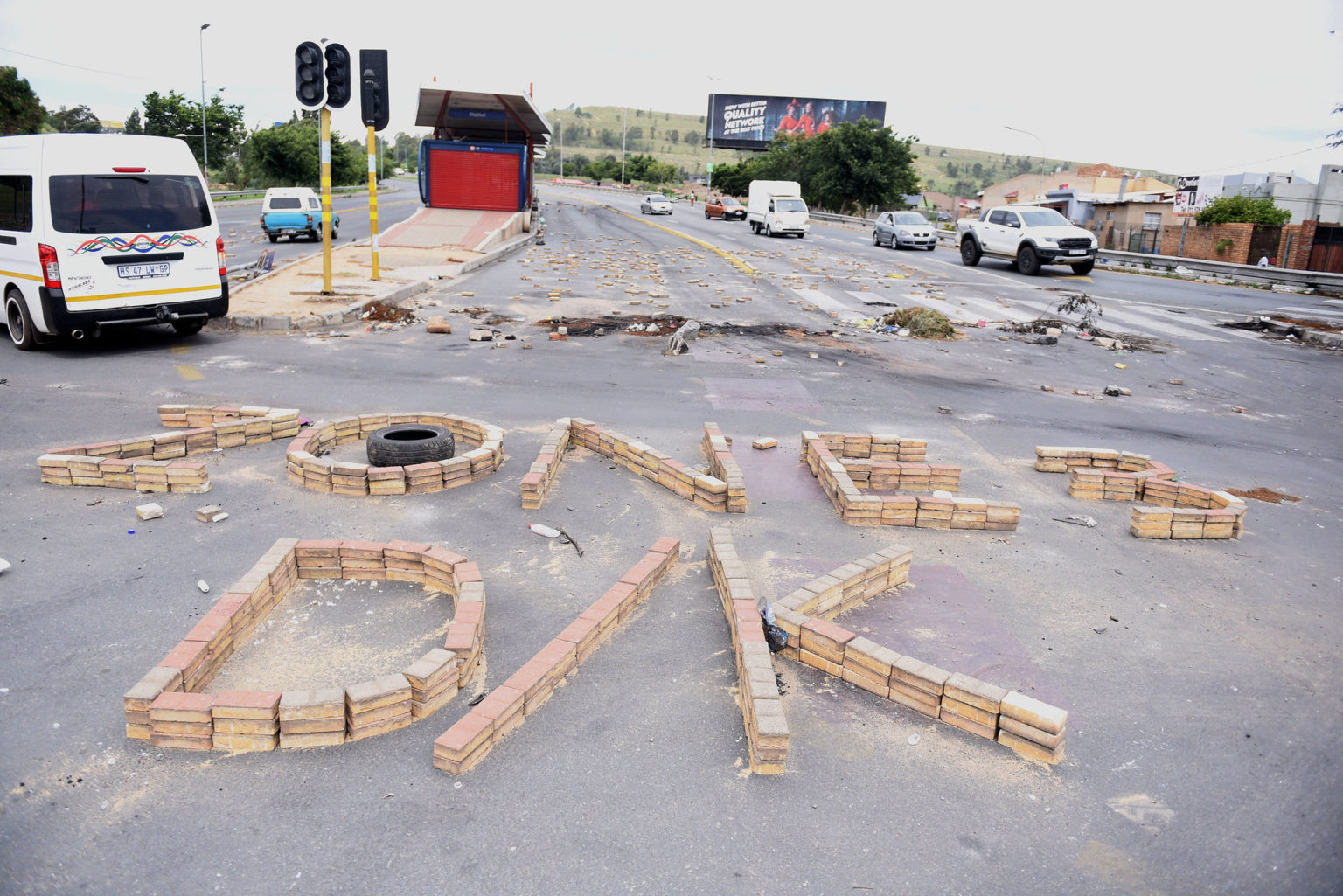 Residents of Diepkloof Zone 3 in Soweto barricaded the Soweto Highway near the N1, 7 December 2021, with large rocks after power cuts in the area