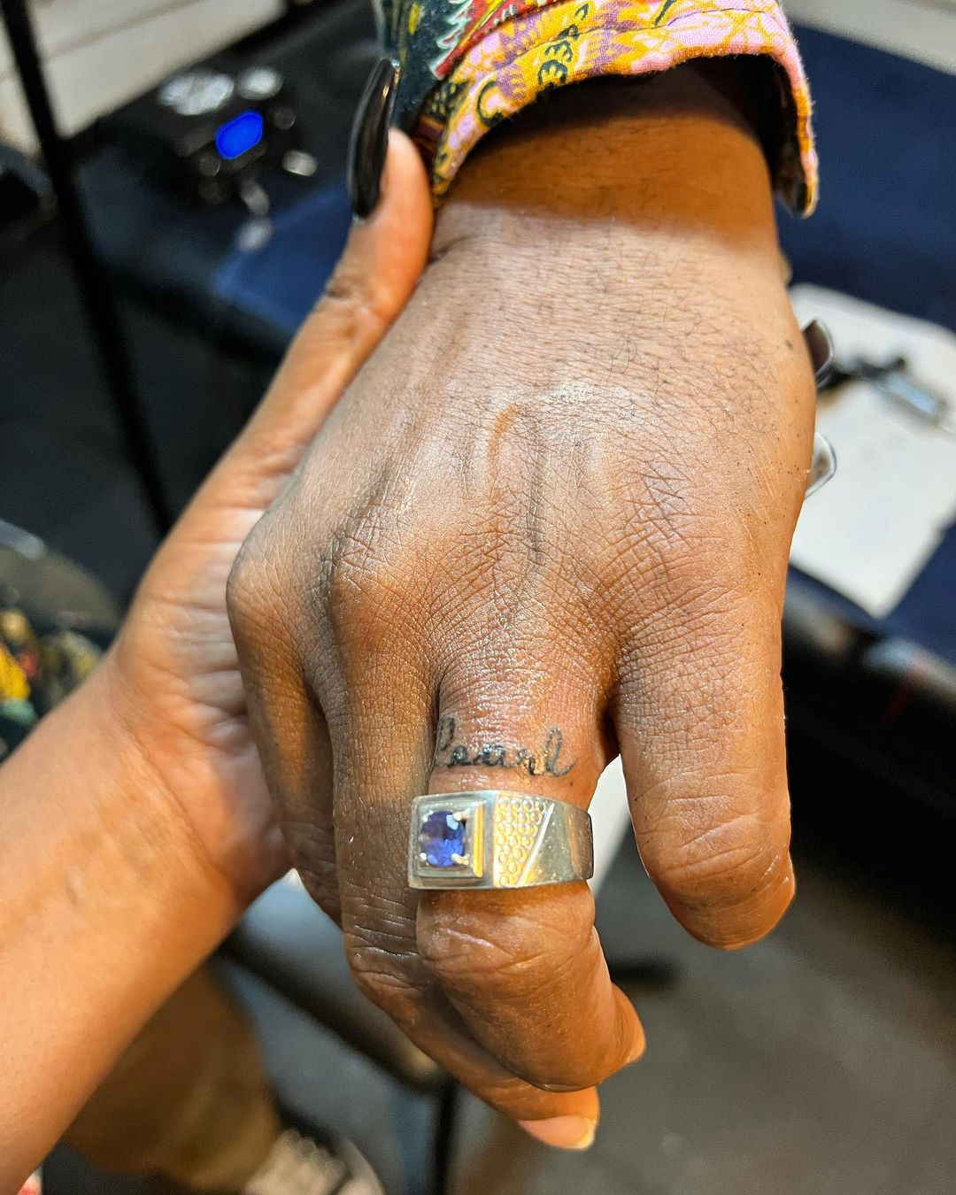 Watch: Actor Sello Maake kaNcube tattoos Pearl's name on his ring finger - Mbare Times