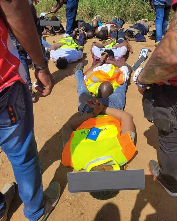 Armed robbers arrive in cars marked Department of Labour and UIF, not knowing cops were waiting