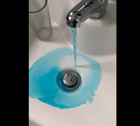 blue water coming out of the tap