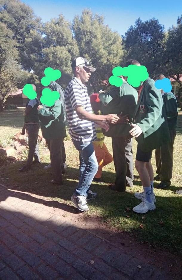 Police frisk learners at Hoerskool John Voster in Ekurhuleni during drive to promote safety