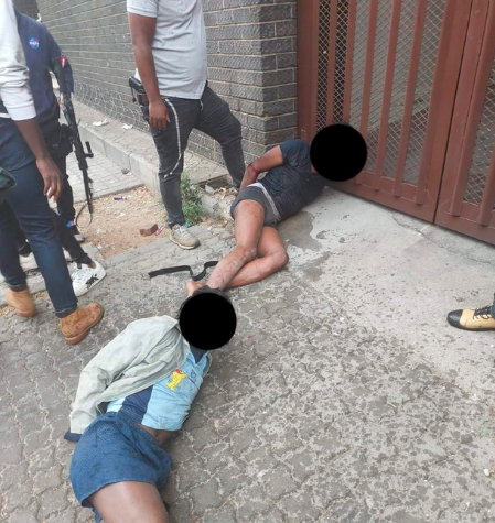 2 robbers accosted by police in Joburg CBD while choking a woman & searching her
