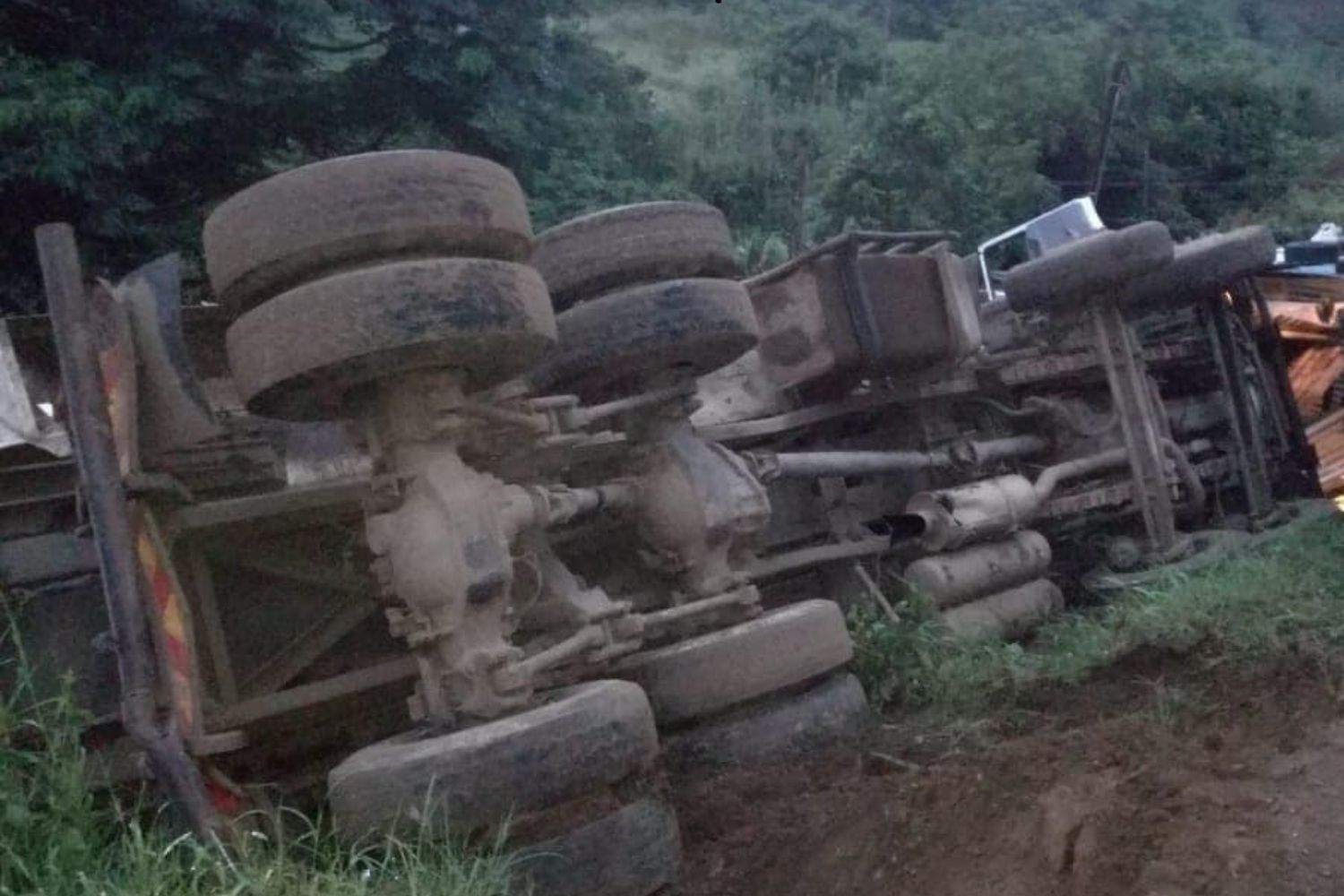 Man buried in sand as tip-truck overturns