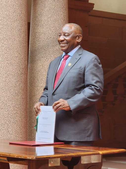 President Cyril Ramaphosa, joined by the Minister of Health, Dr Joe Phaahla, signing into law the National Health Insurance (NHI) Bill